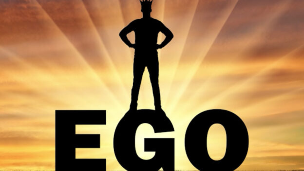Person standing on the word, ego